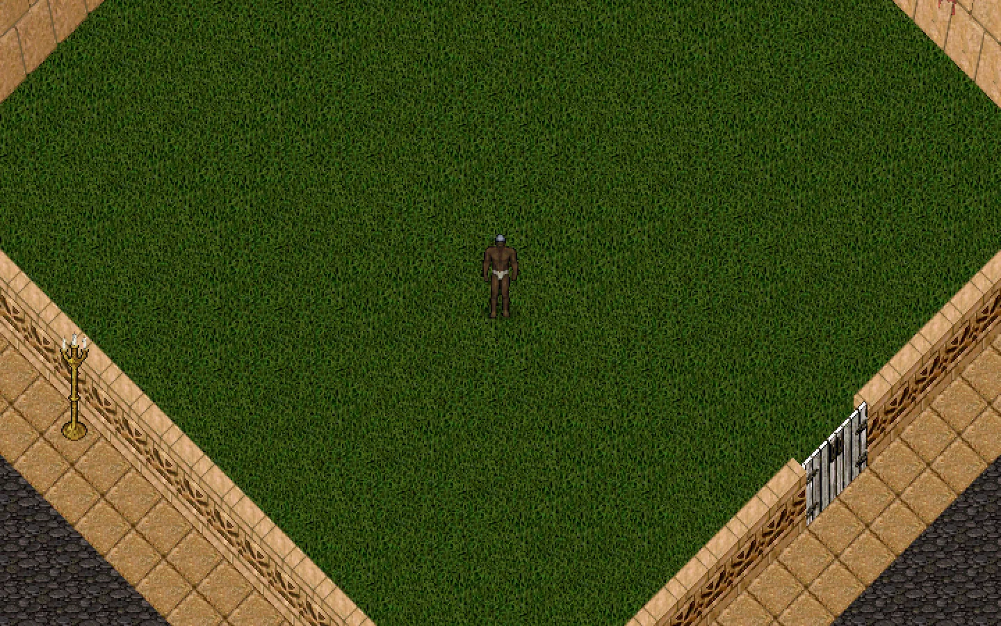 The grass field of the tournament arena between its walls, with the iron gate, candelabra and the walkway around it